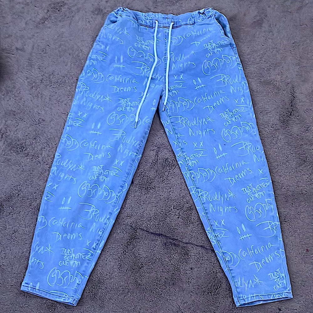 blue jeans with words on them